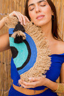 "Half-Moon Handiwork: The Hand-Braided EYE Clutch"