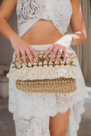 Tasseled Treasure: Sea Shell Clutch with Pom Coins