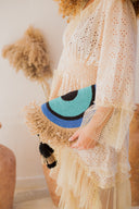 "Half-Moon Handiwork: The Hand-Braided EYE Clutch"