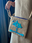 Blooming Beauty in Your Hands: The Hand-Weaved Lotus Clutch