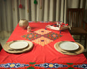 Mosaic Marvel: A Red Tablecloth with a Unique Patchwork Design