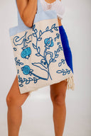 Timeless tote is always in style! The intricate pomegranate embroidery adds a touch of style