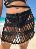 "Shell We Dance: Short Hand-Knitted Skirt with Dangling Shells"