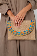 The Elegant Ensemble: The Hand-Braided Lotus Clutch